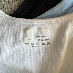 White, black and blue bodysuits